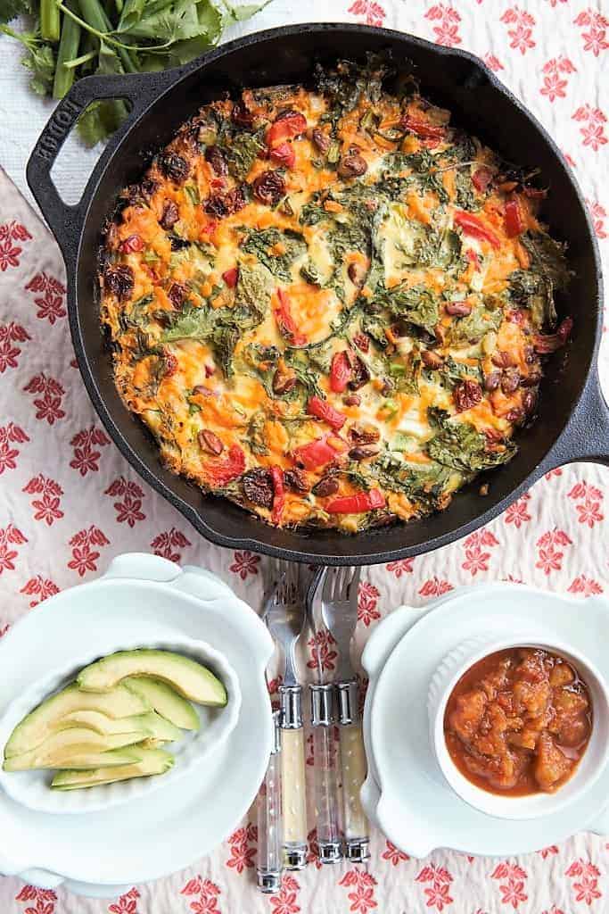 Grafted Pro breakfast skillet with vegetables and cheese, served with avocado slices and salsa, showcasing a flavorful, healthy meal perfect for brunch or dinner.